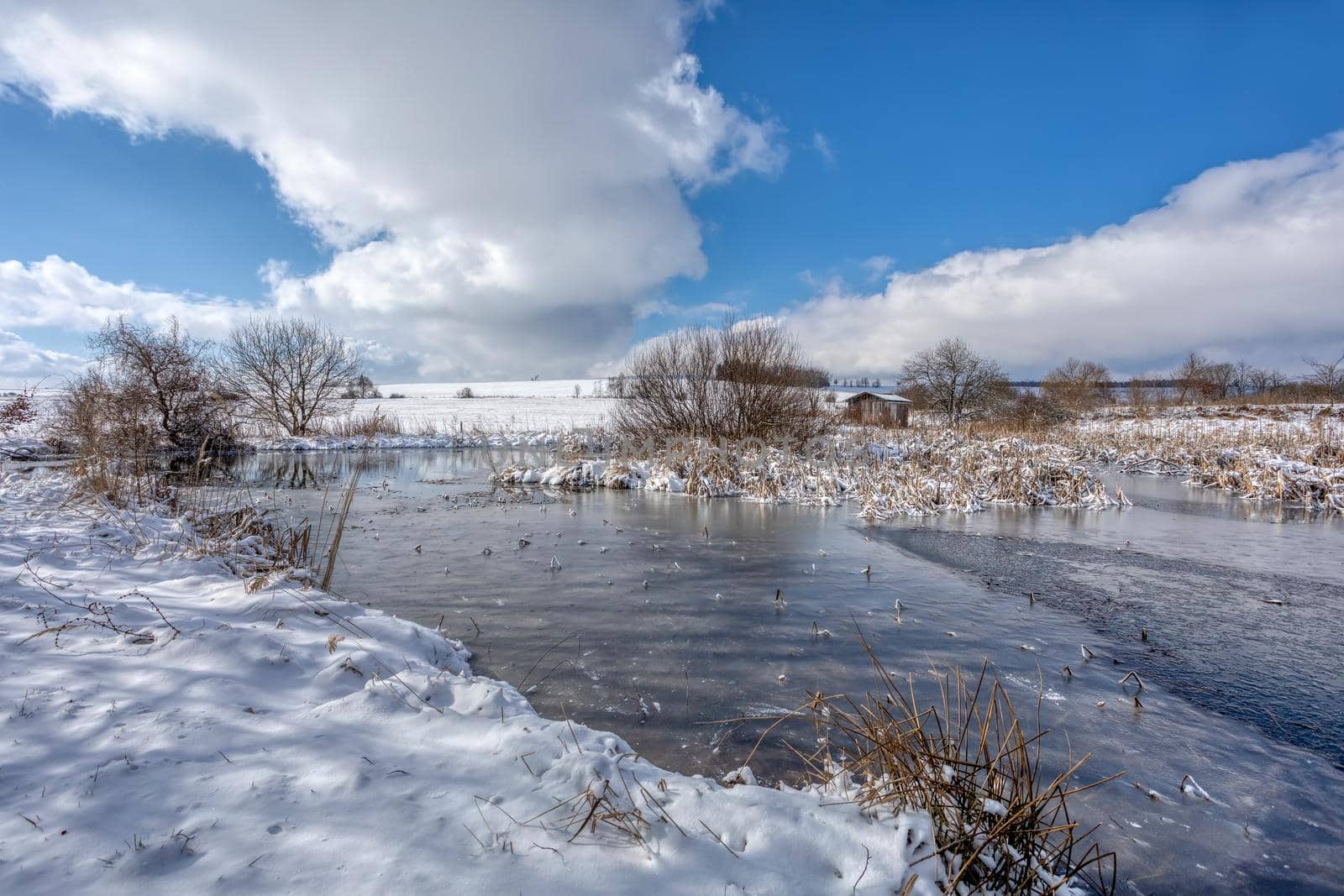 Landscape with frozen small pond. Czech beautiful highland vysocina european countryside
