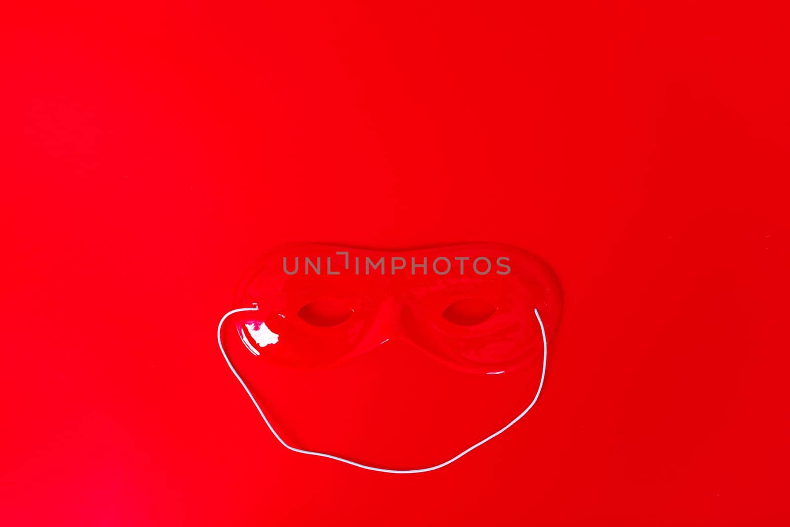 carnival mask on red background