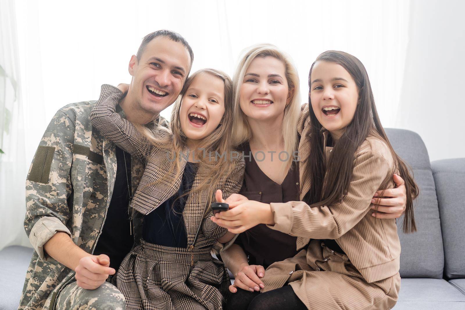 Portrait Of Soldier Returning Home With Family.