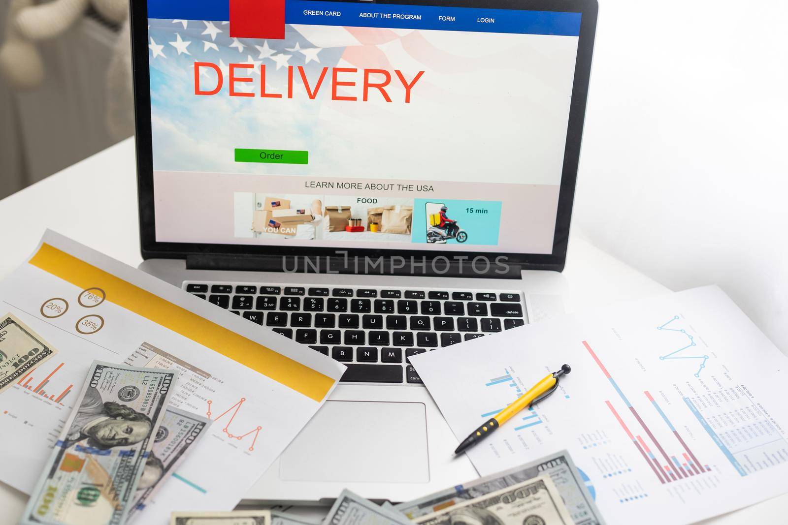 Online shopping ecommerce and shipping concepts A cardboard box with a cart or cart logo on a laptop keyboard represents a customer placing an order from a retail store over the Internet. by Andelov13