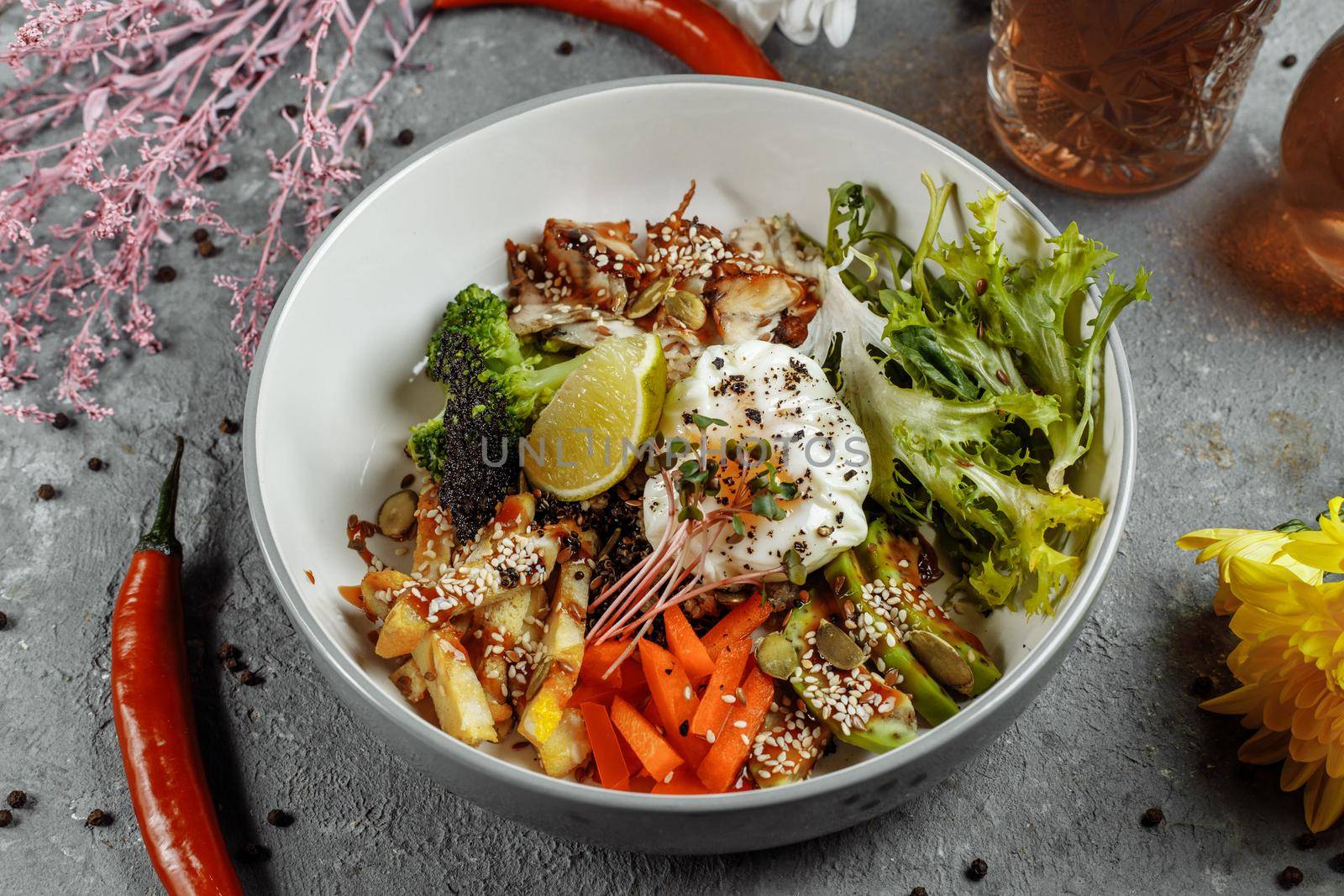 Healthy bowl - quinoa salad with tuna, broccoli, avocado on wooden rustic table. top view.