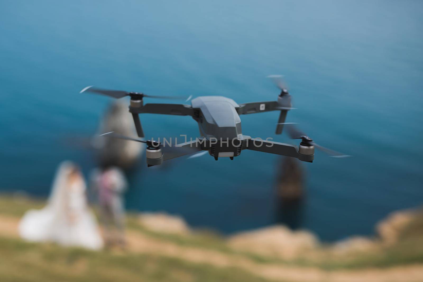 Flying drone shoots wedding video in nature