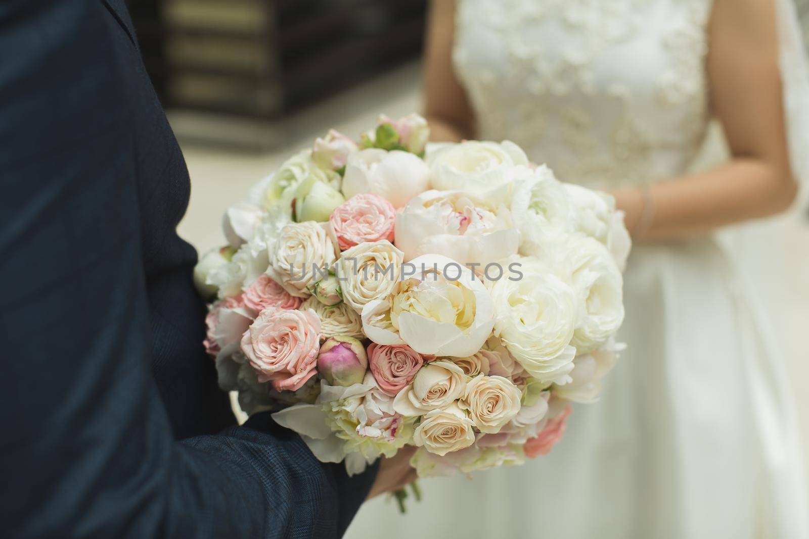 bouquet of flowers in the hands of the bride