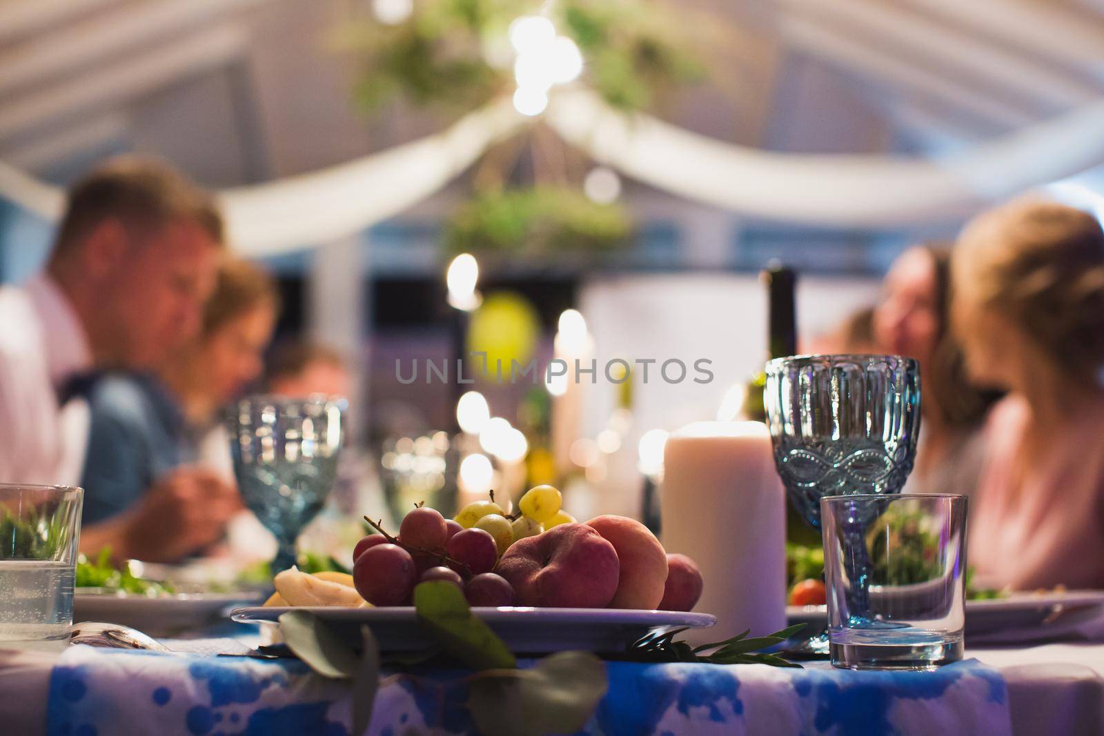 Guests eat at the wedding table. Table close-up