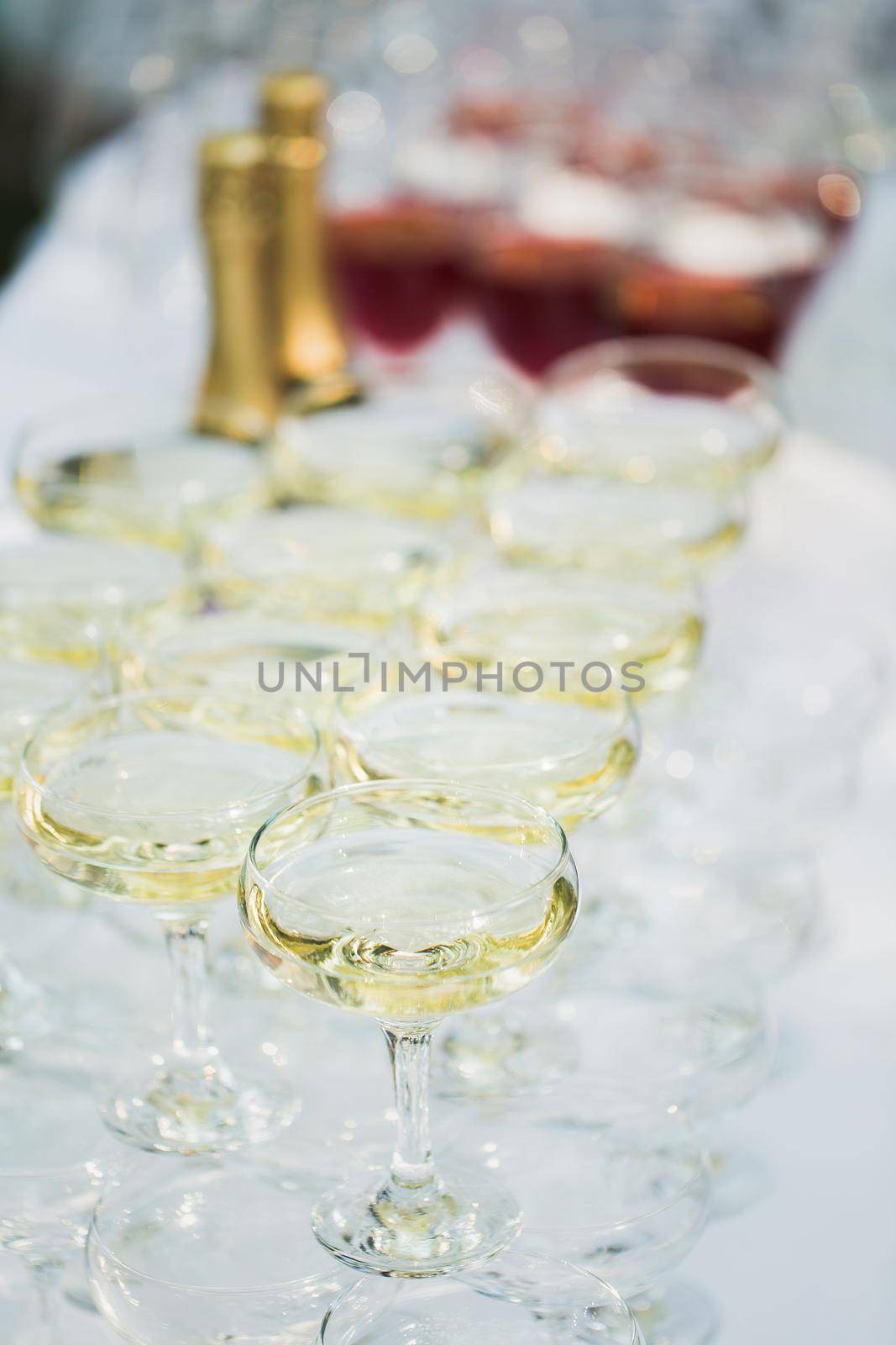 Many glasses of champagne at the wedding reception.