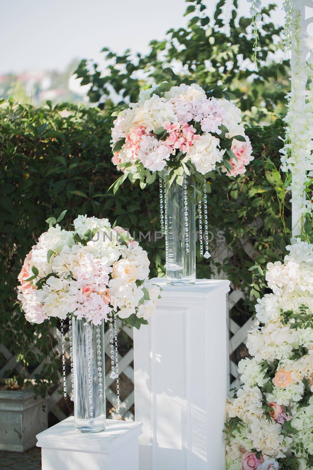 Beautiful wedding ceremony in the park. Decor of flowers and crystal beads by StudioPeace