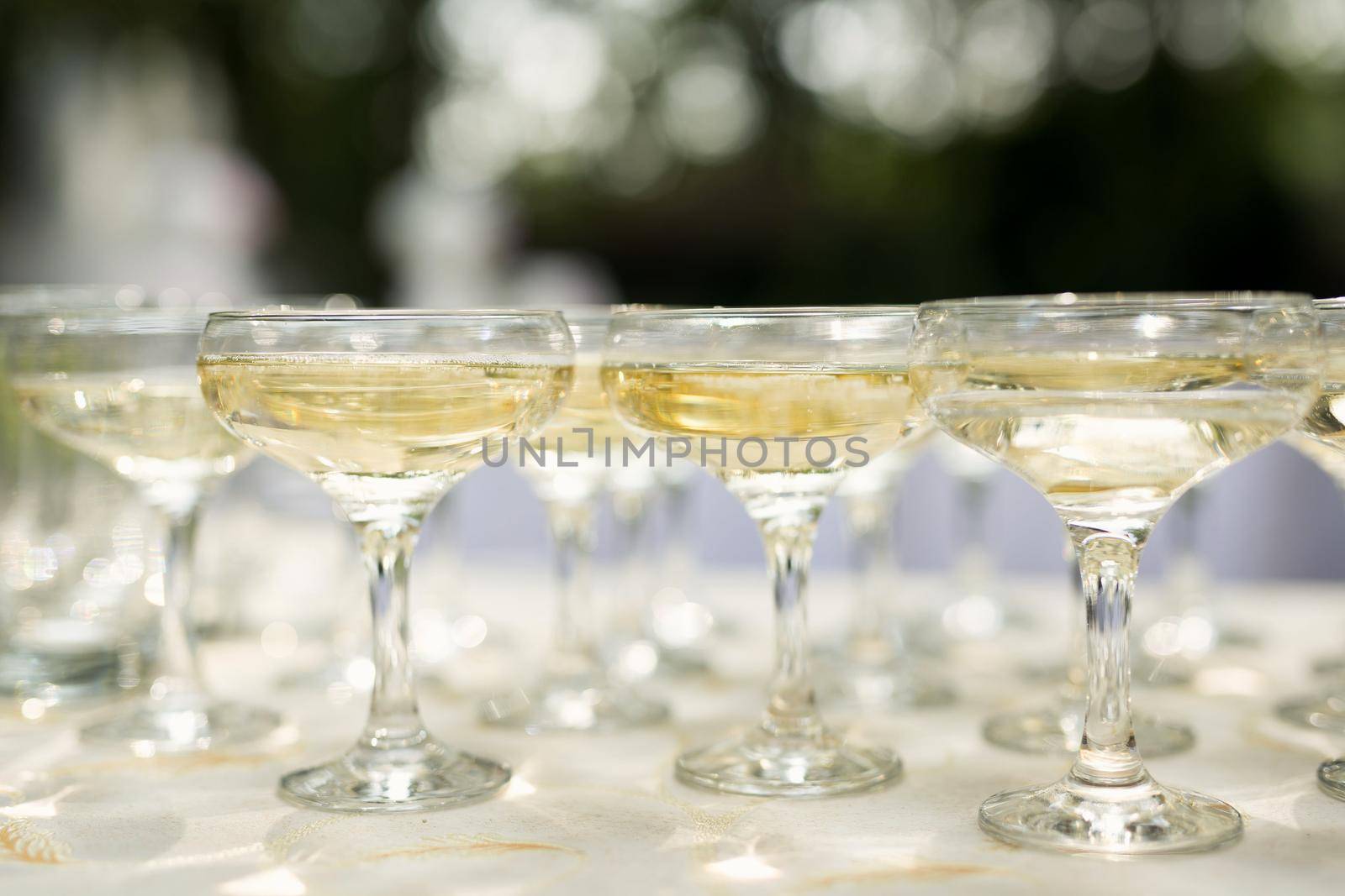 Glasses of alcohol close- up before a party in a cafe. by StudioPeace