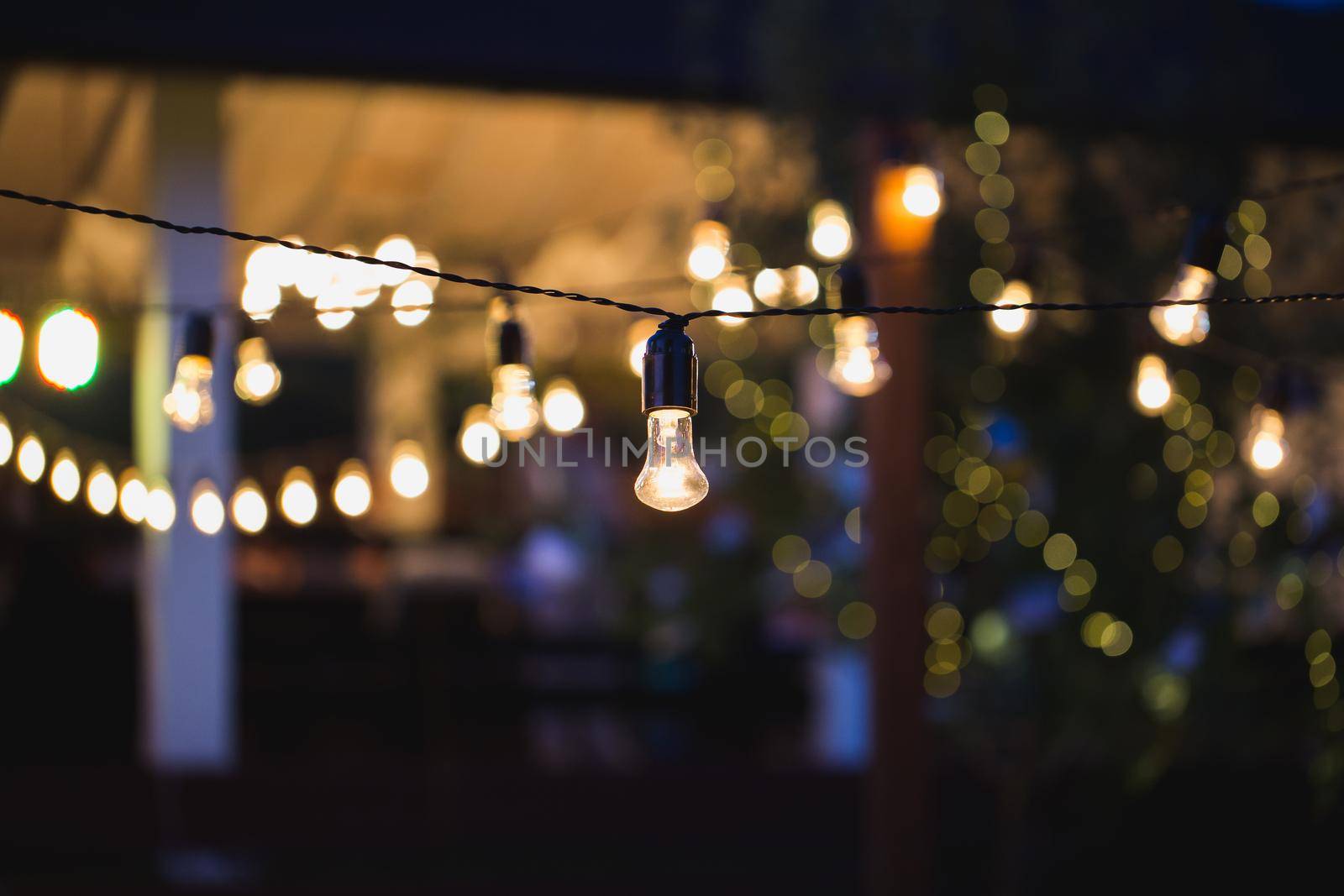 outdoor string lights hanging on a line in backyard. by StudioPeace