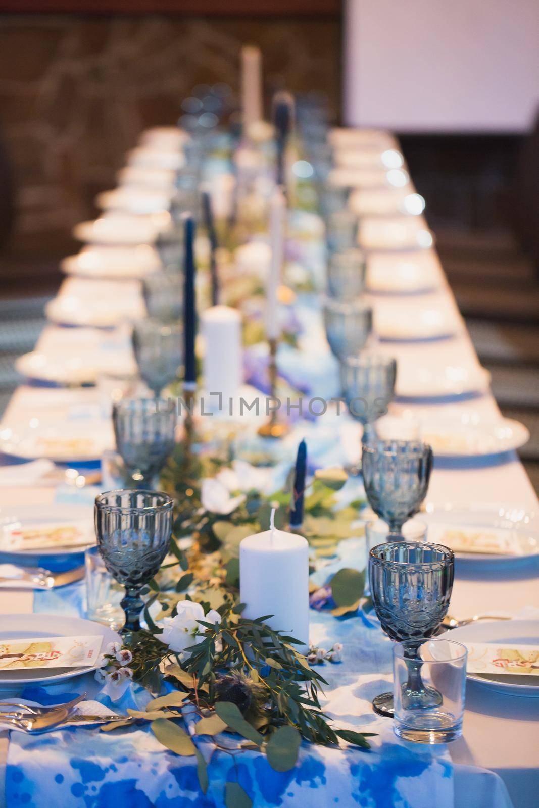 Wedding banquet. Table setting with blue glasses. by StudioPeace