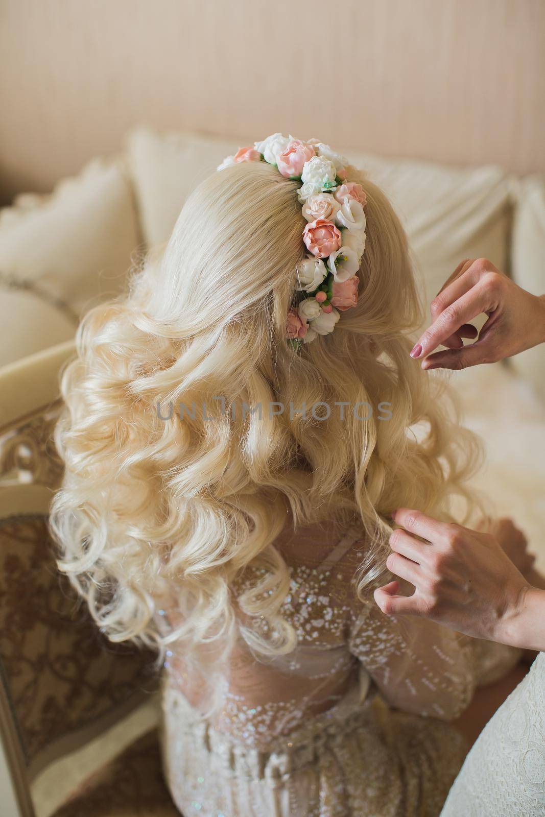 Bride's fees in the morning on the wedding day. Beautiful hairstyle and headband made of fresh flowers by StudioPeace