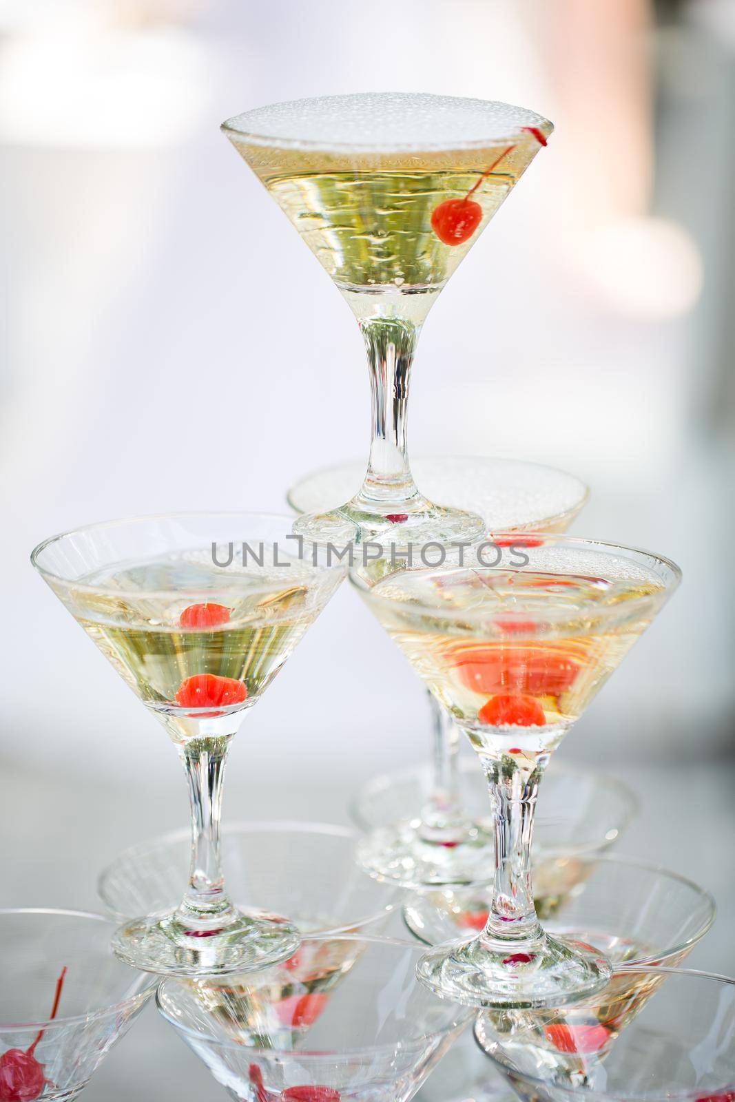 Pyramid of glasses, cherry in the glass