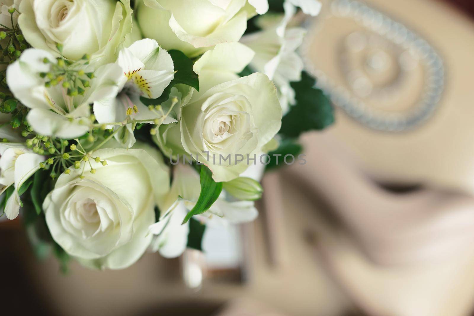 Delicate wedding bouquet of white flowers close-up by StudioPeace