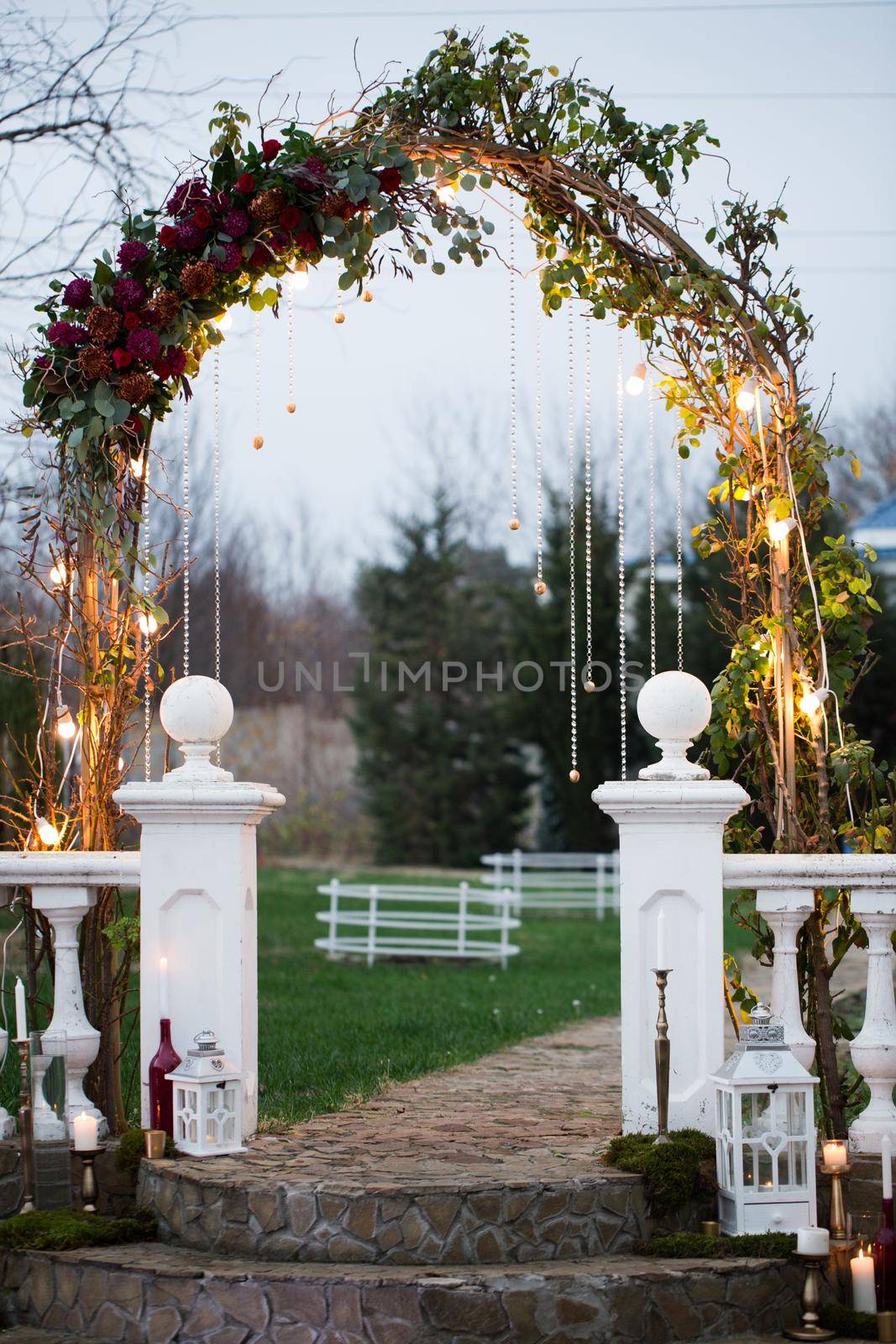 Wedding arch in an ancient park at sunset. by StudioPeace