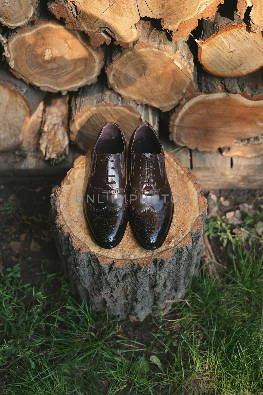 Shoes on a wooden background. Men's accessories. Top view. by StudioPeace