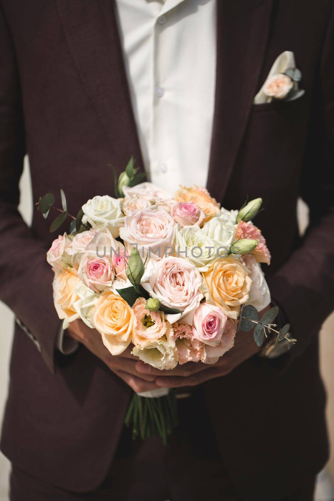 Beautiful bouquet of colorful roses in the hands of the groom by StudioPeace