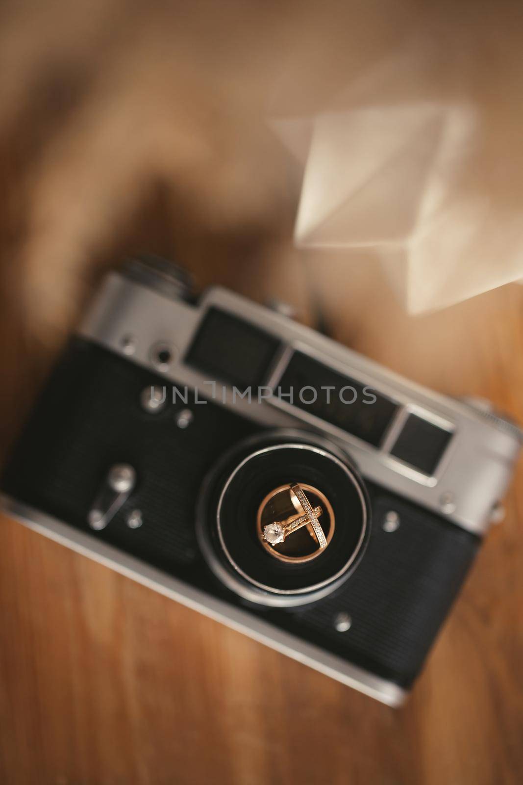 Wedding rings on an old camera. Details of the wedding day by StudioPeace
