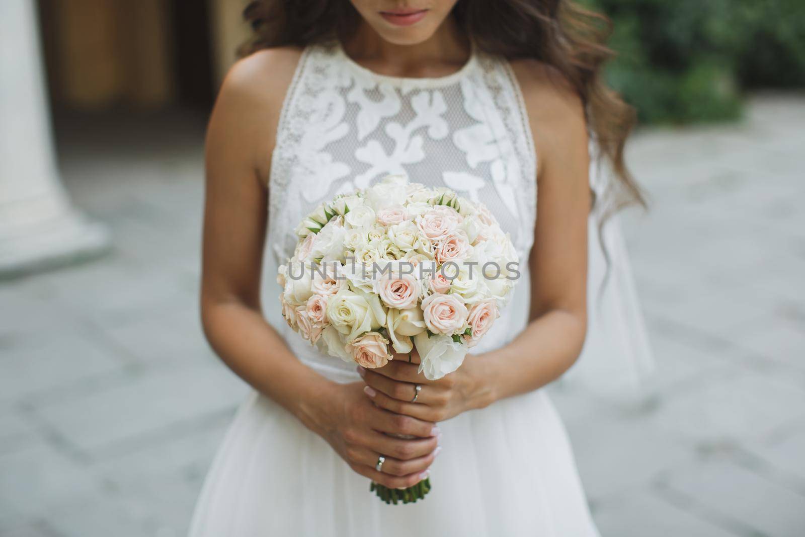 Beautiful wedding bouquet in hands of the bride. by StudioPeace