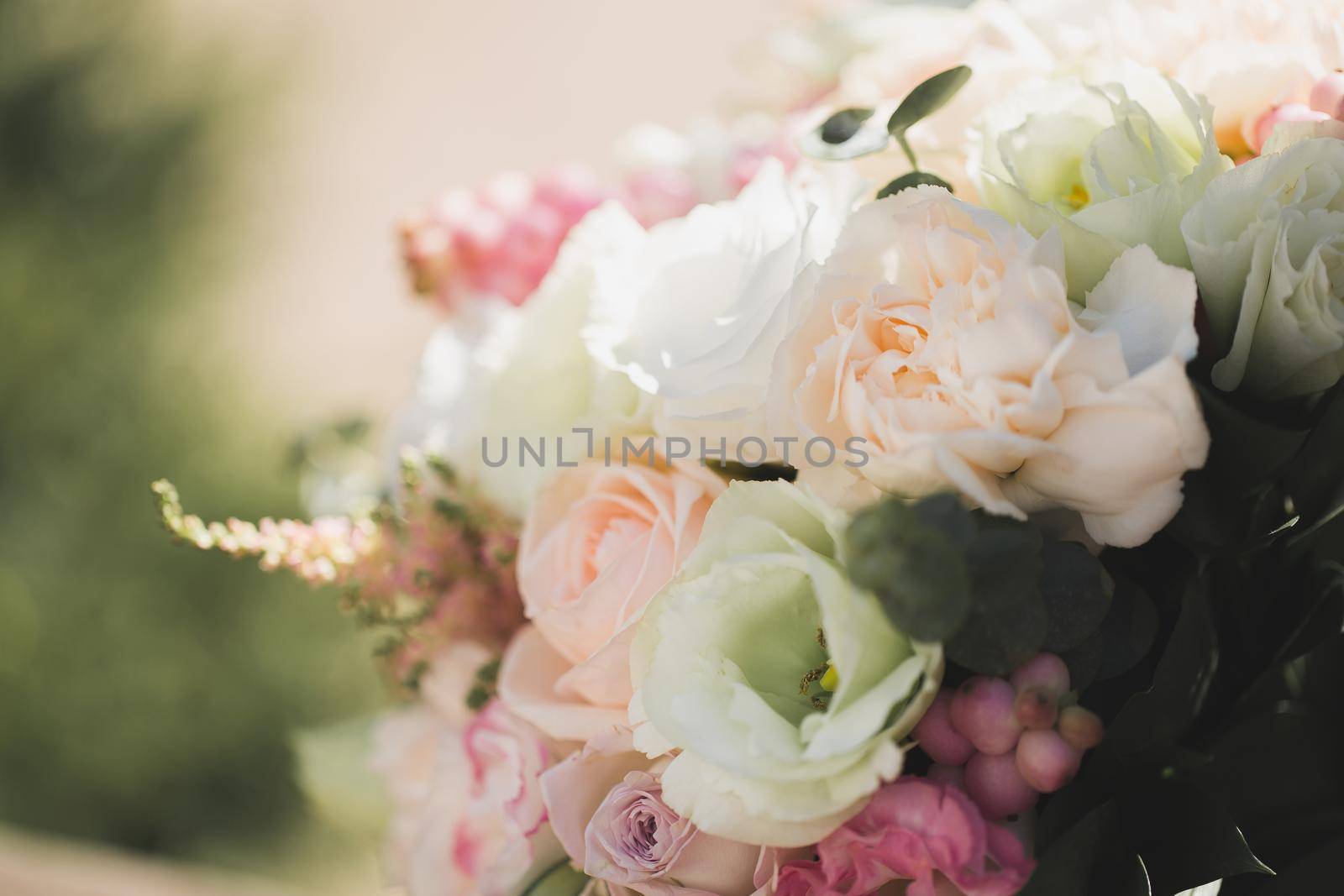 A luxurious delicate wedding bouquet of roses and eustom close-up by StudioPeace