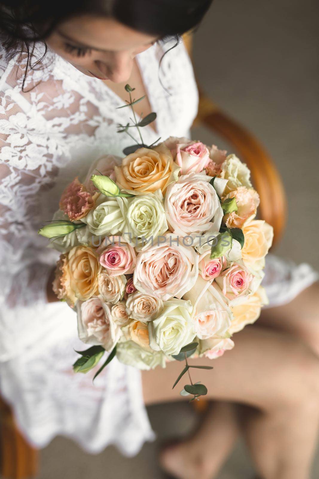 Close-up of a bouquet of flowers in the hands of the bride by StudioPeace