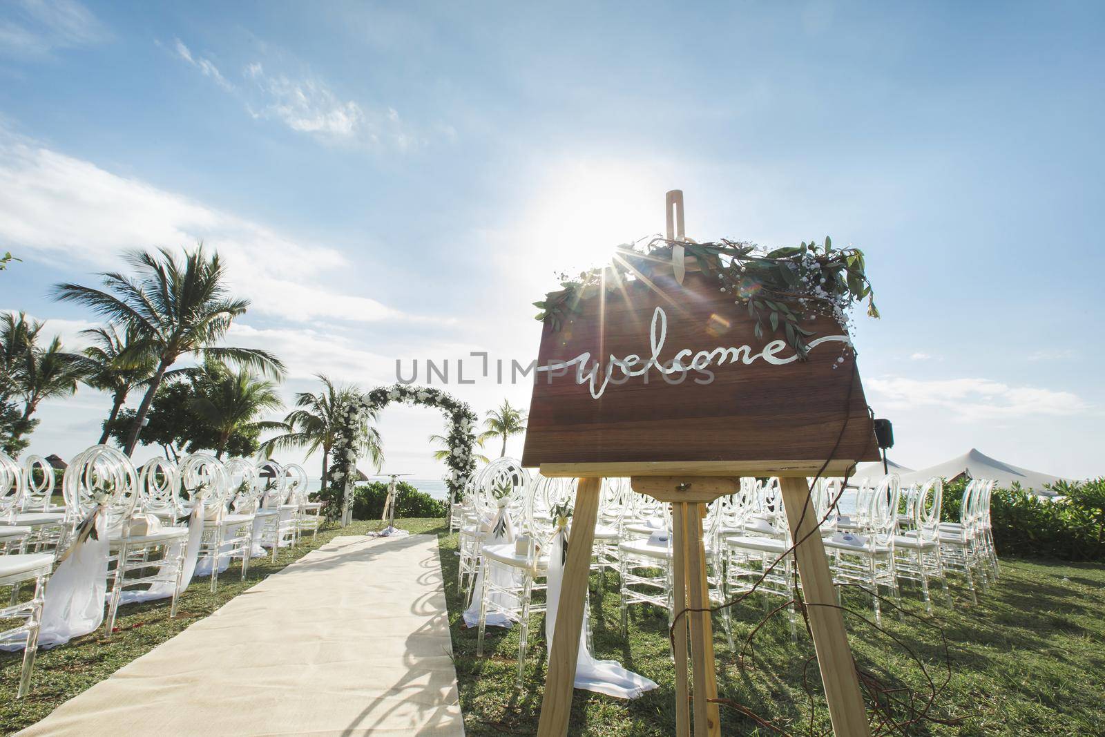 Romantic wedding ceremony on the beach. Sign welcome. by StudioPeace