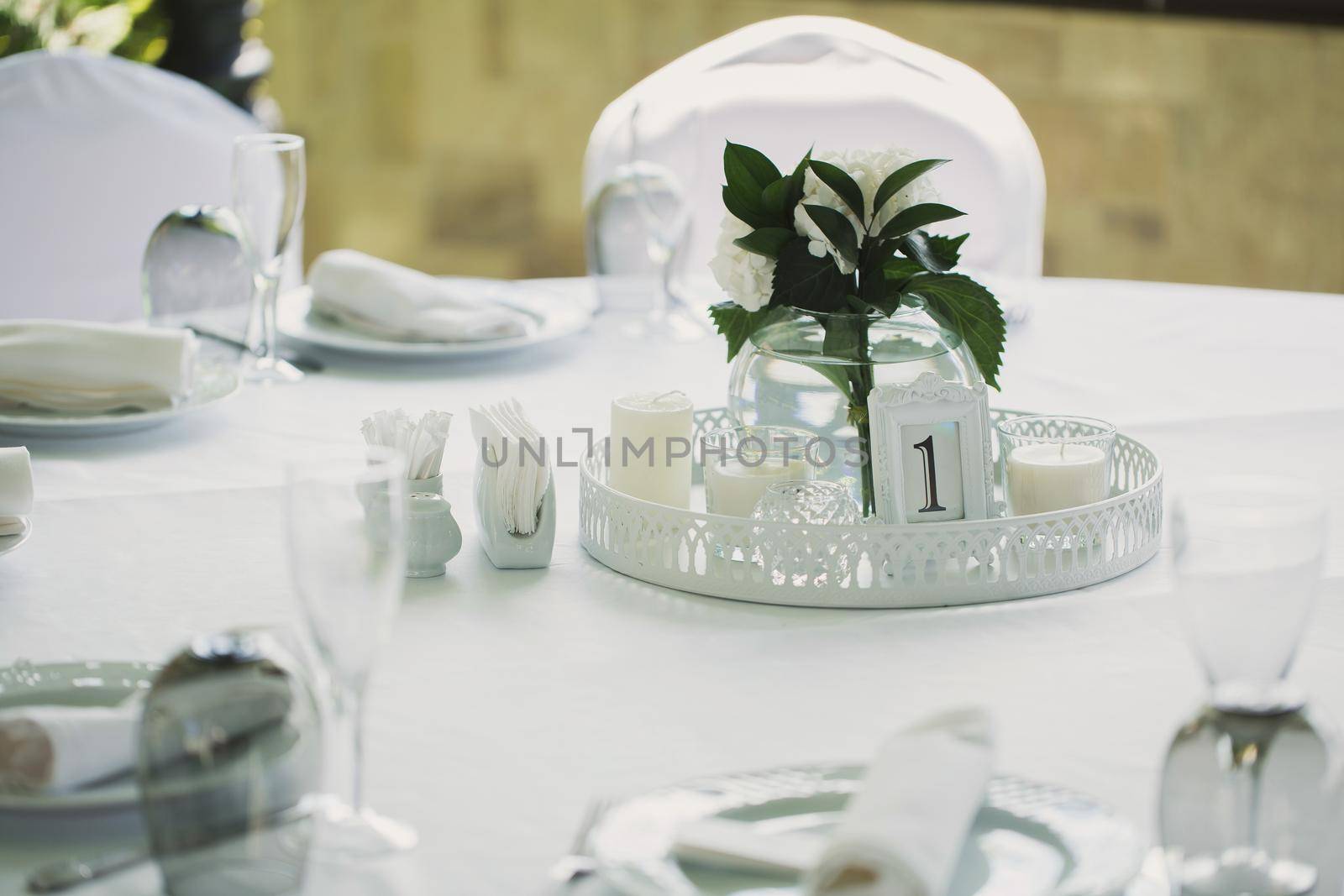 Beautifully decorated tables for guests with decorations. by StudioPeace