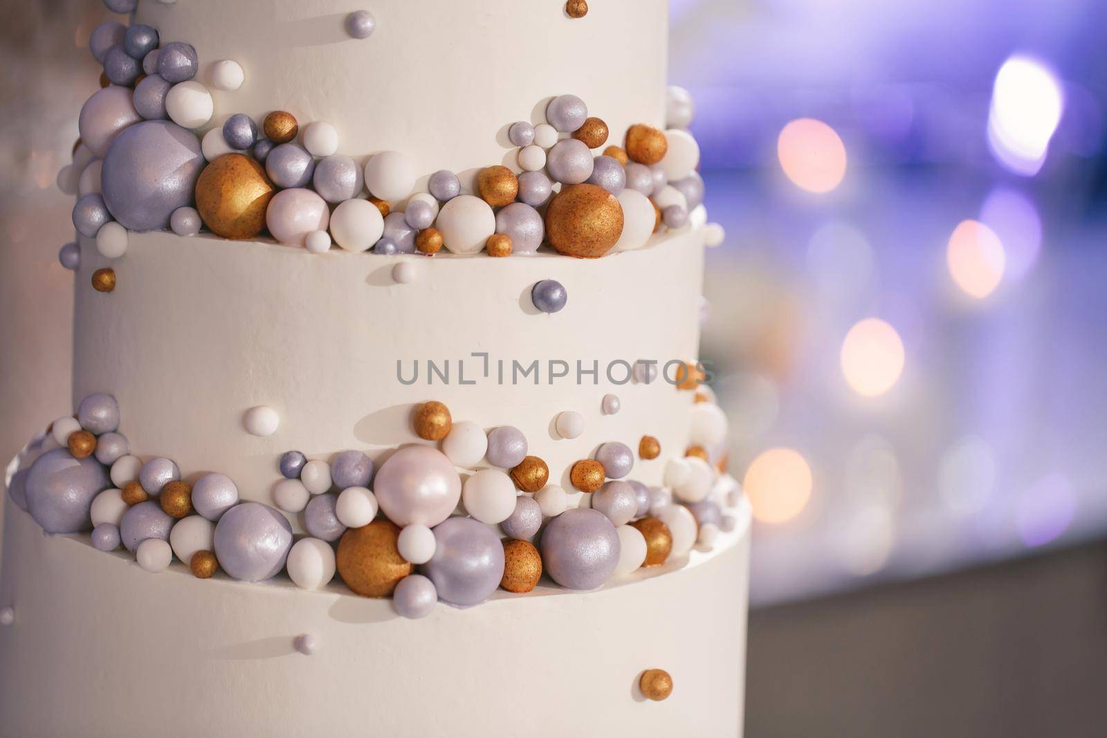 Beautiful wedding cake for the newlyweds at the wedding. A birthday cake at a banquet.