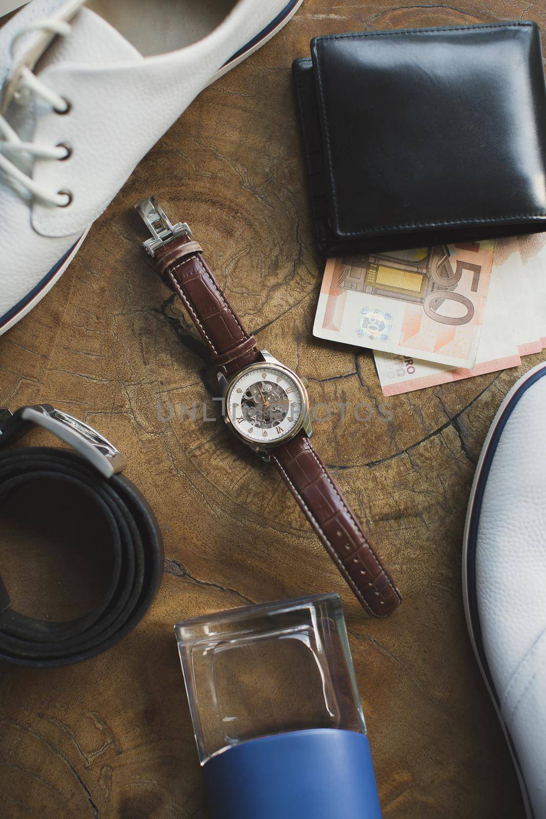 Accessories for men on a wooden table.