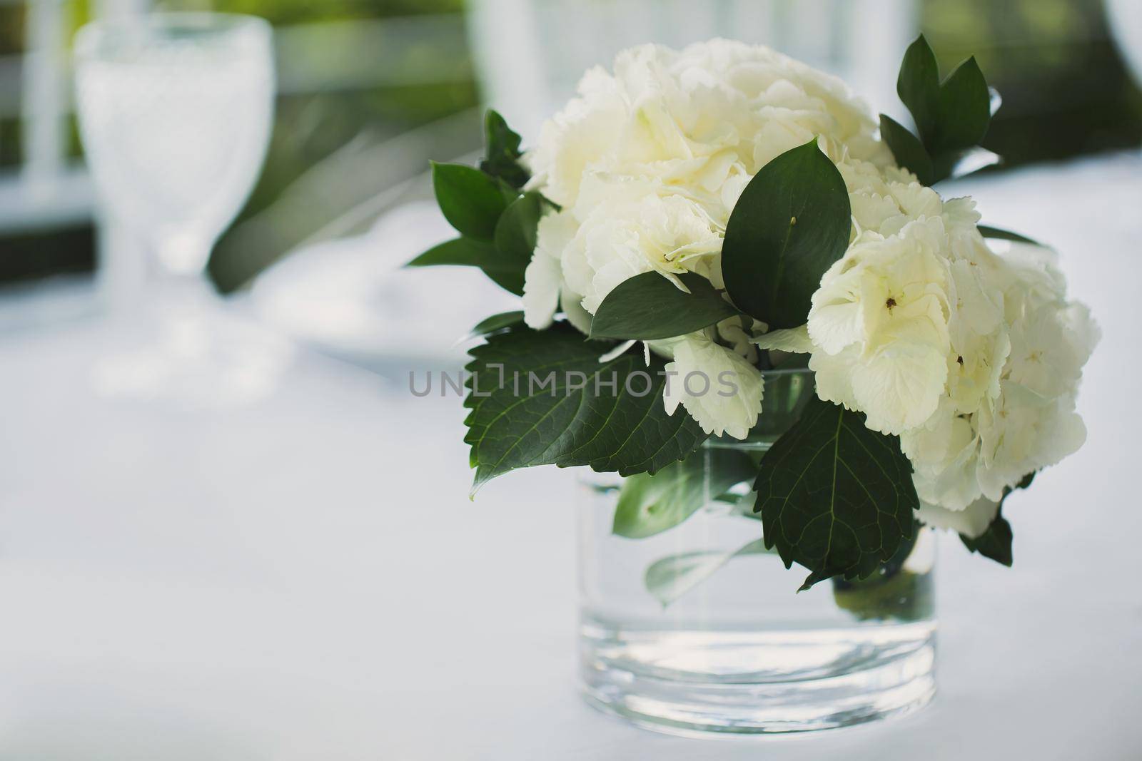 White flowers in a vase on the Bridal table