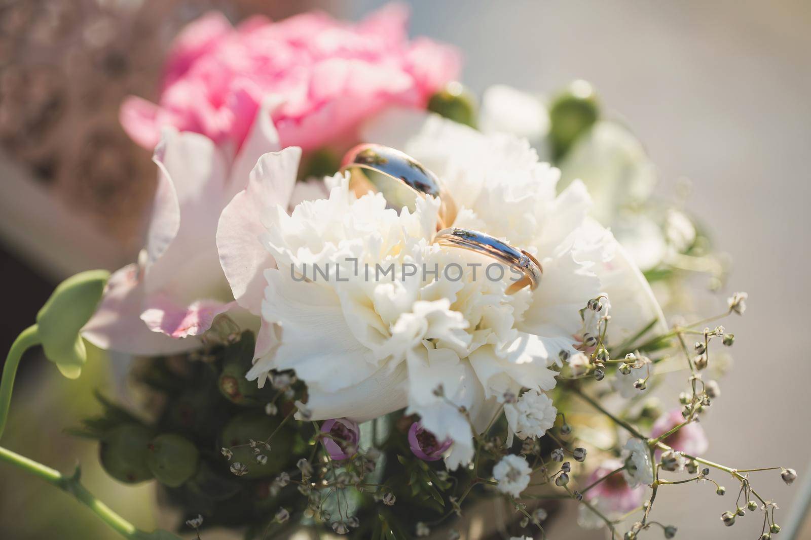 Wedding rings in a box with flowers. by StudioPeace