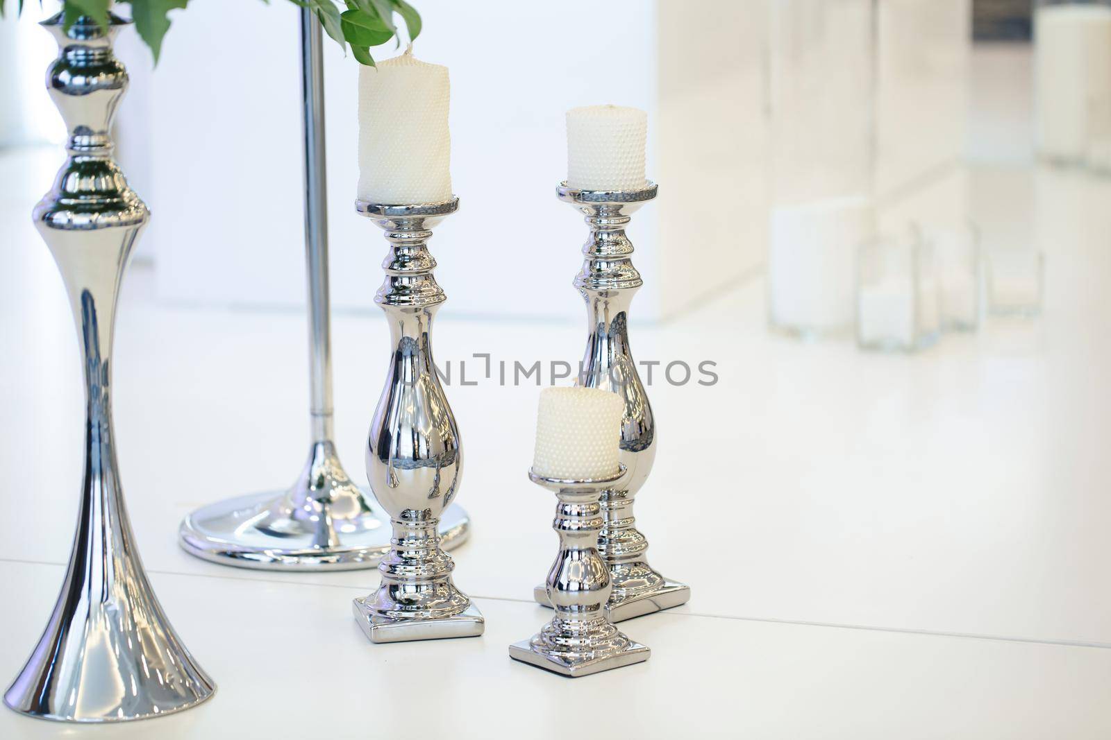 Wedding candle holder with floral decoration at the wedding banquet by StudioPeace