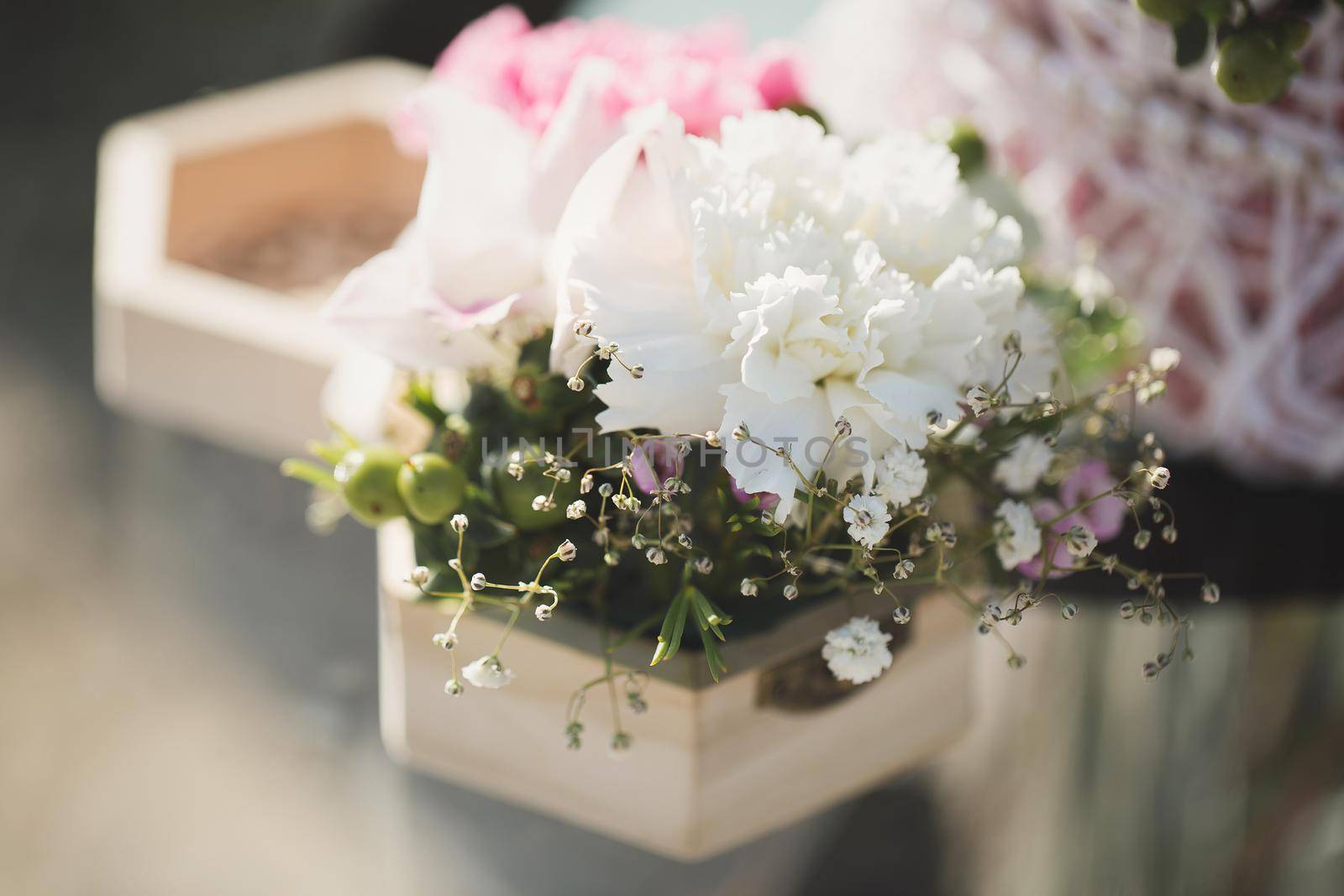 Wedding rings and a composition of fresh flowers on the registration table.