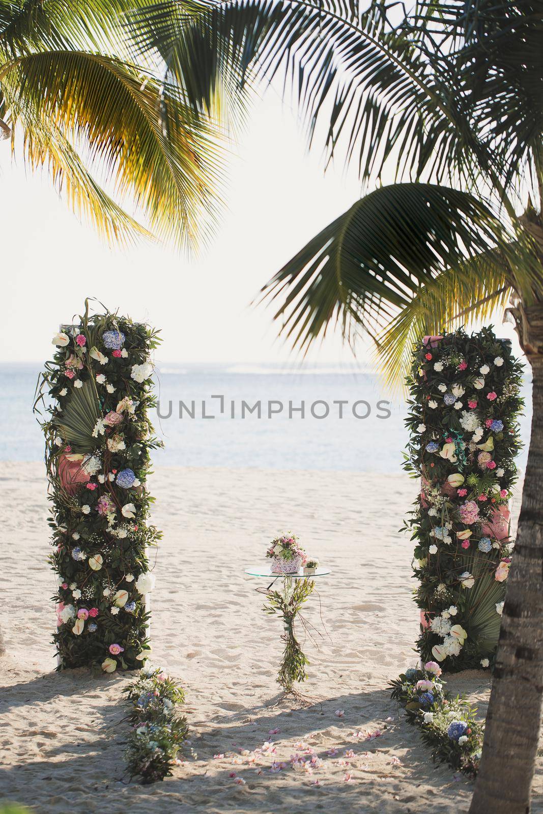 Wedding arch on the beach on the background of the ocean.