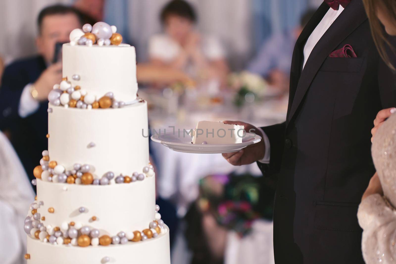 Beautiful wedding cake for the newlyweds at the wedding. A birthday cake at a banquet.