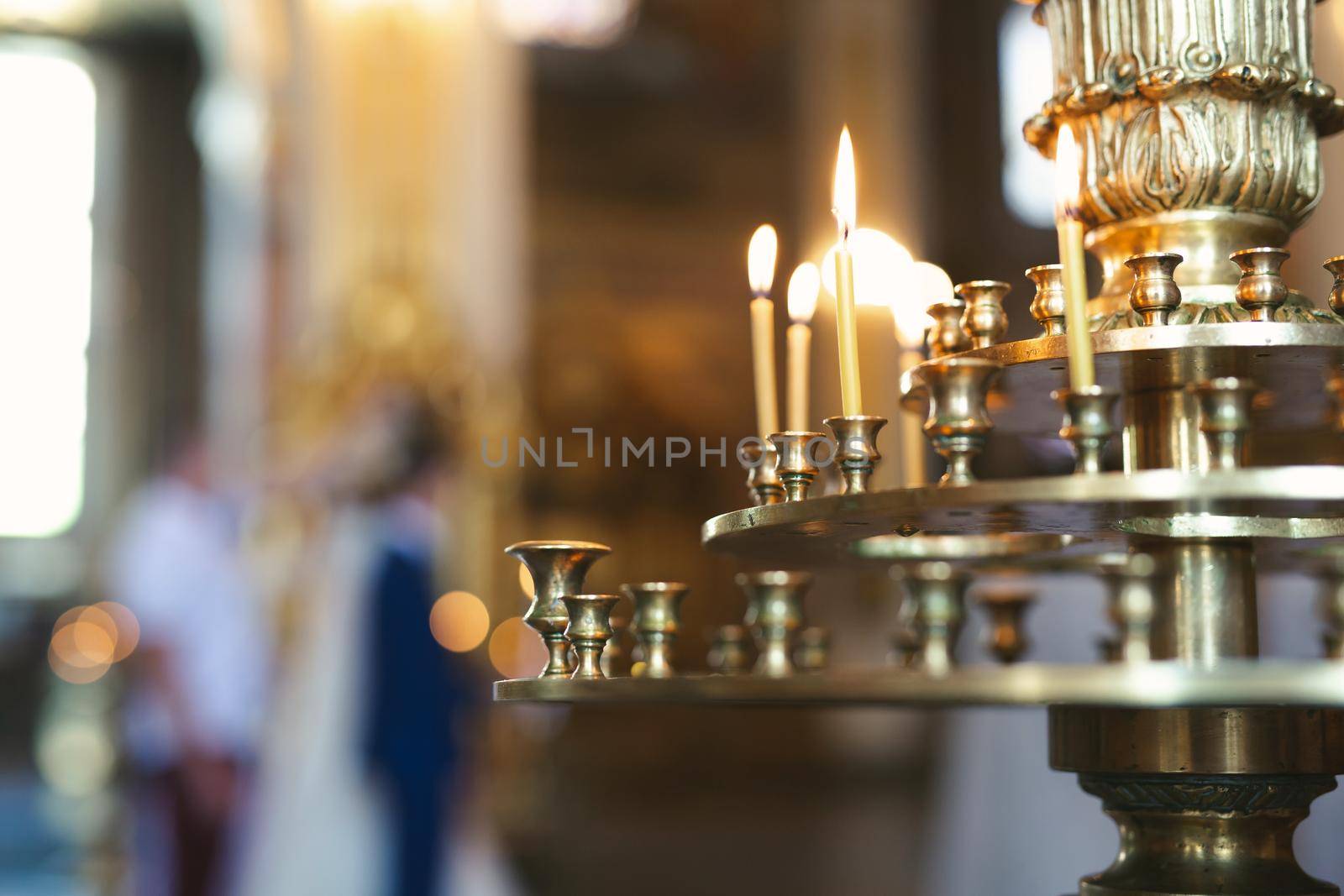 Close-up of candles in the church before the wedding ceremony.