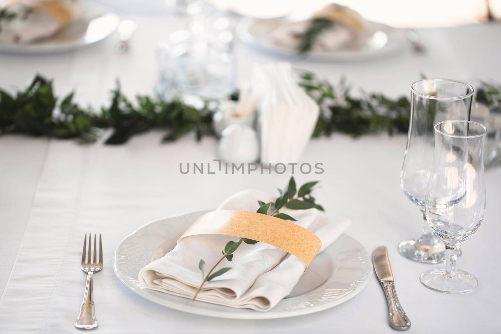 Beautiful setting of the wedding banquet table in the restaurant by StudioPeace