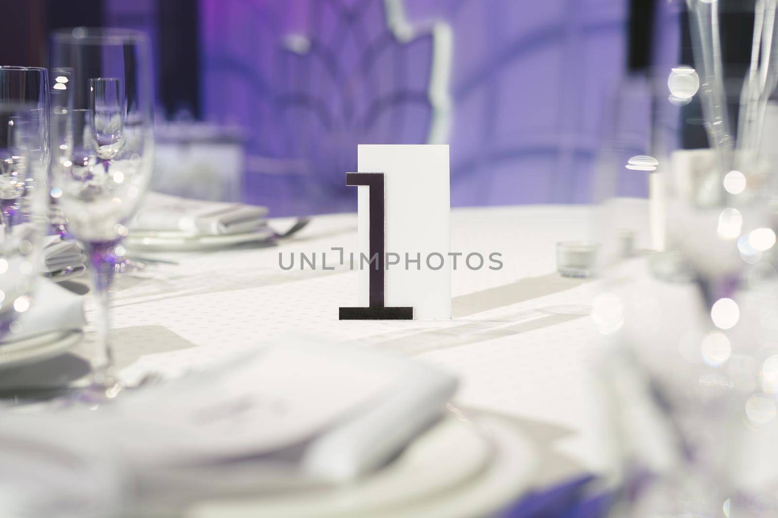 Guest table number. Wedding table in the restaurant by StudioPeace