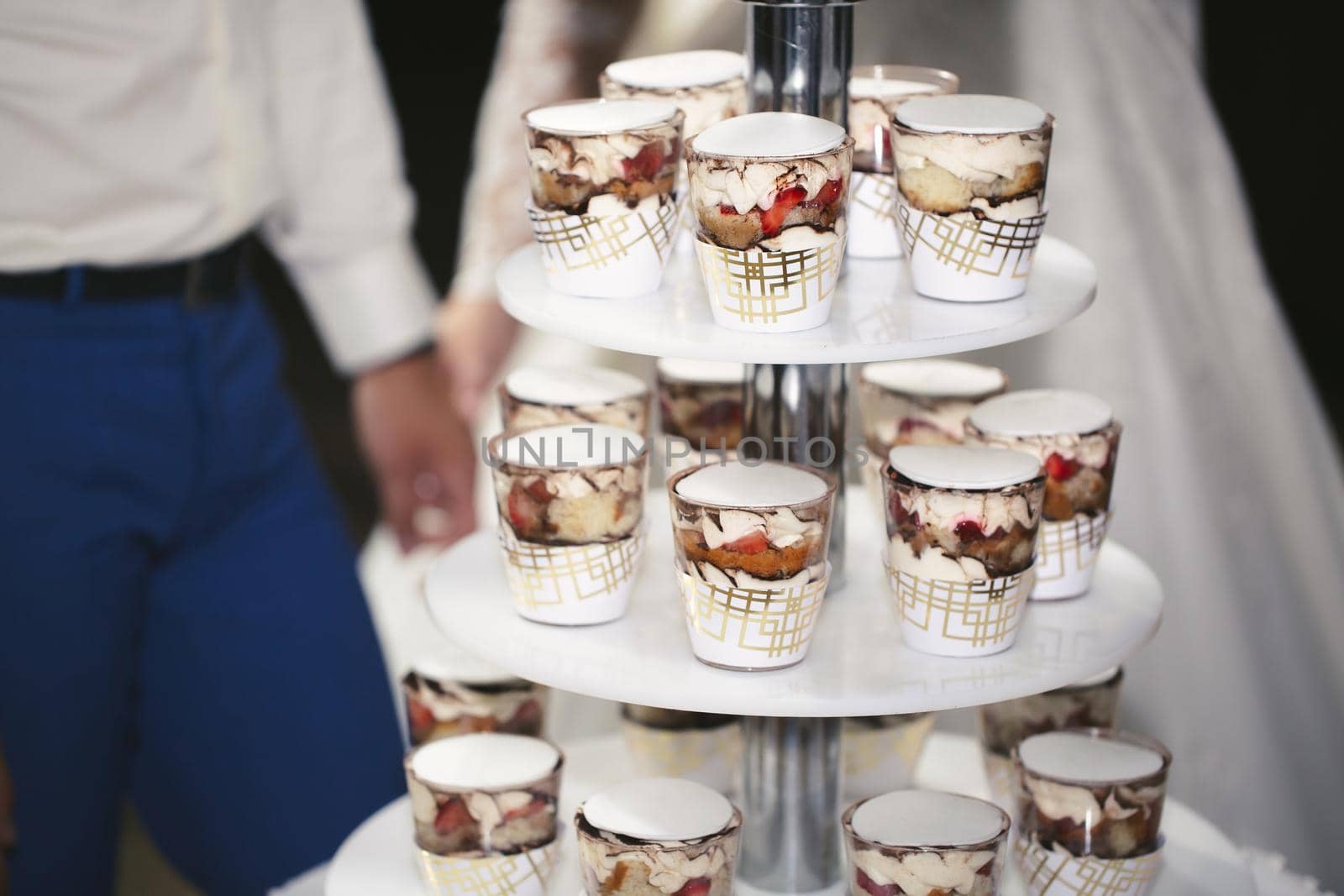 A wedding cake made of trifles on a multi-tiered stand.