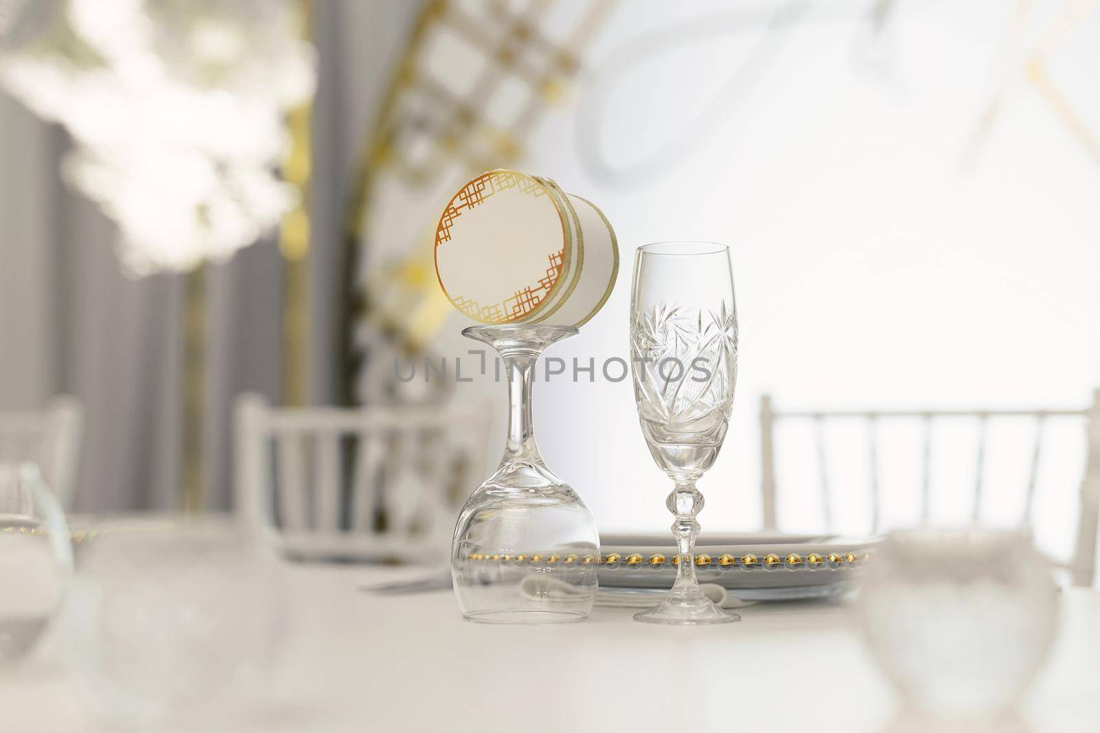 Beautiful setting of the wedding banquet table in the restaurant with the name of the guest by StudioPeace