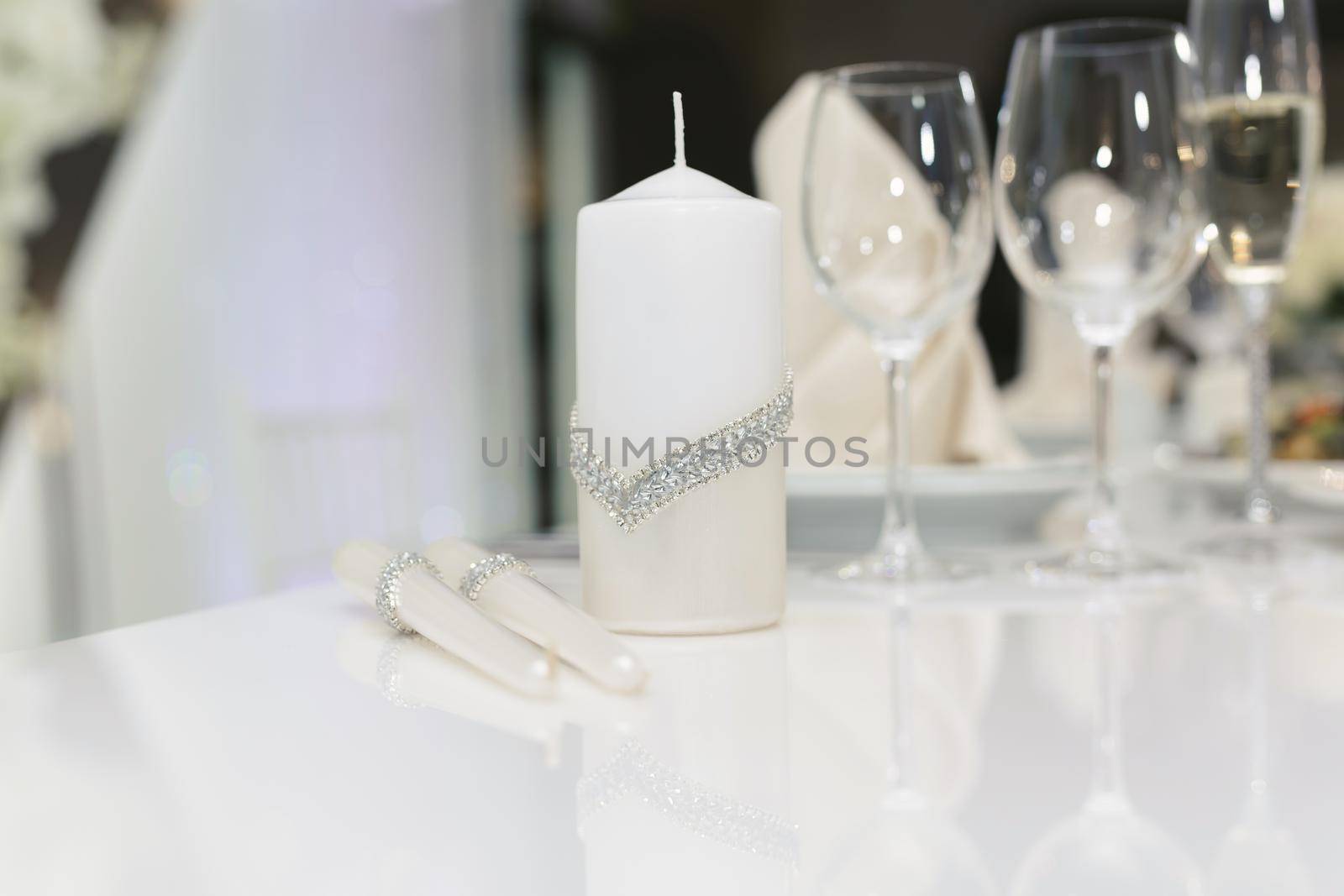 Wedding candles for the family hearth on the festive table by StudioPeace