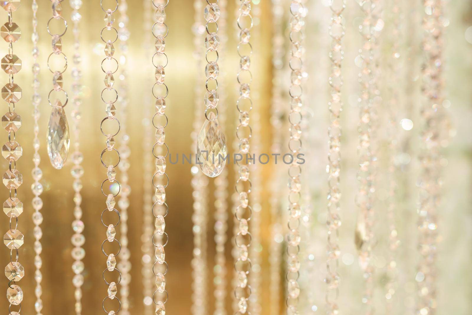 Hanging glass and shiny beads are an element of the wedding decor by StudioPeace