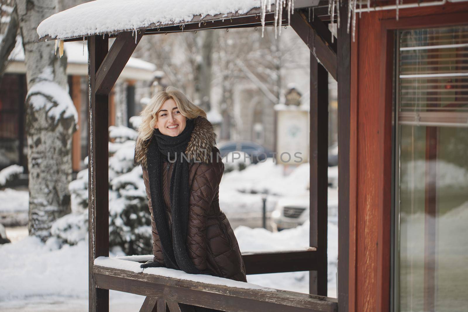 Beautiful woman posing in winter time in the city.