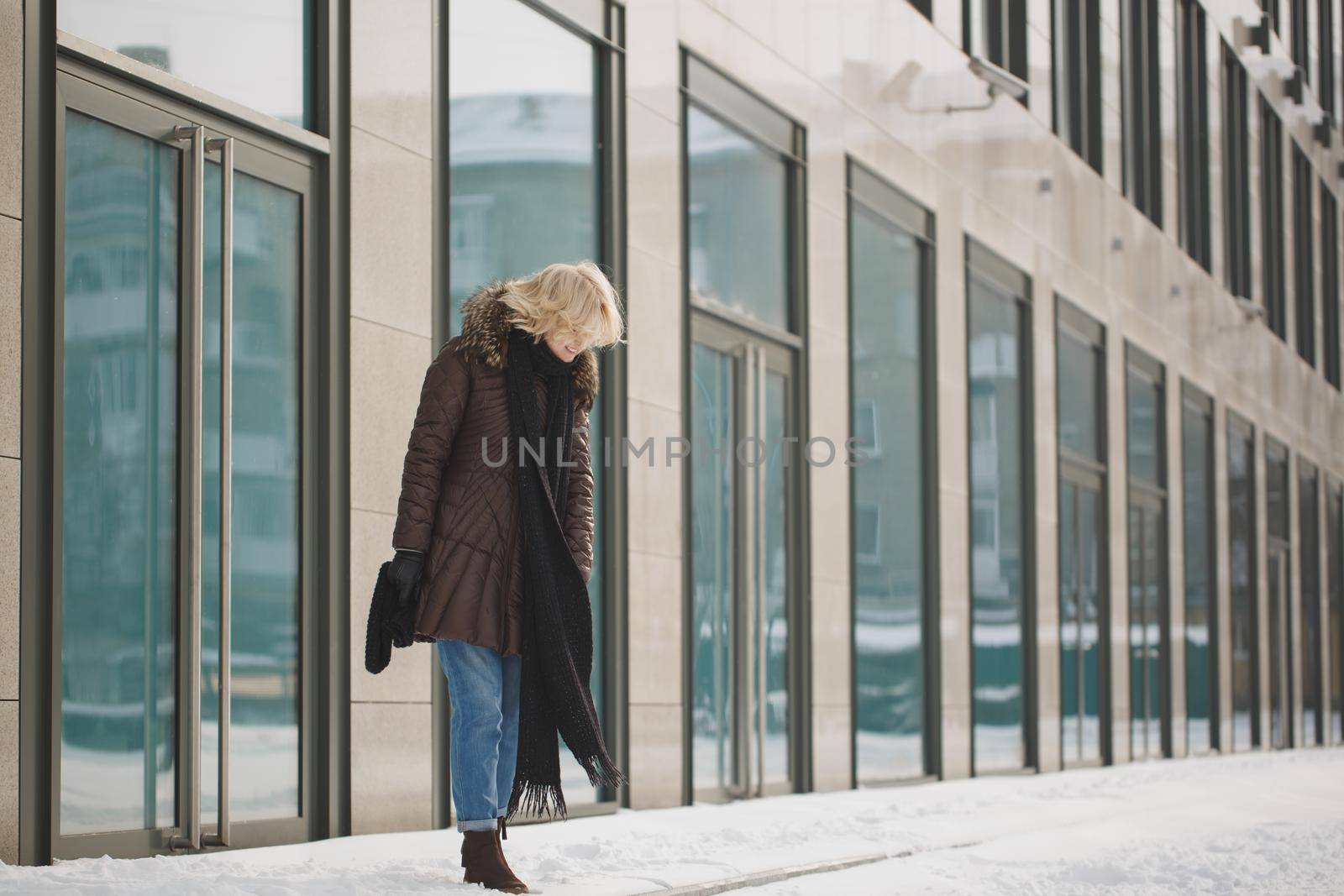 beautiful woman posing near the glass building. by StudioPeace