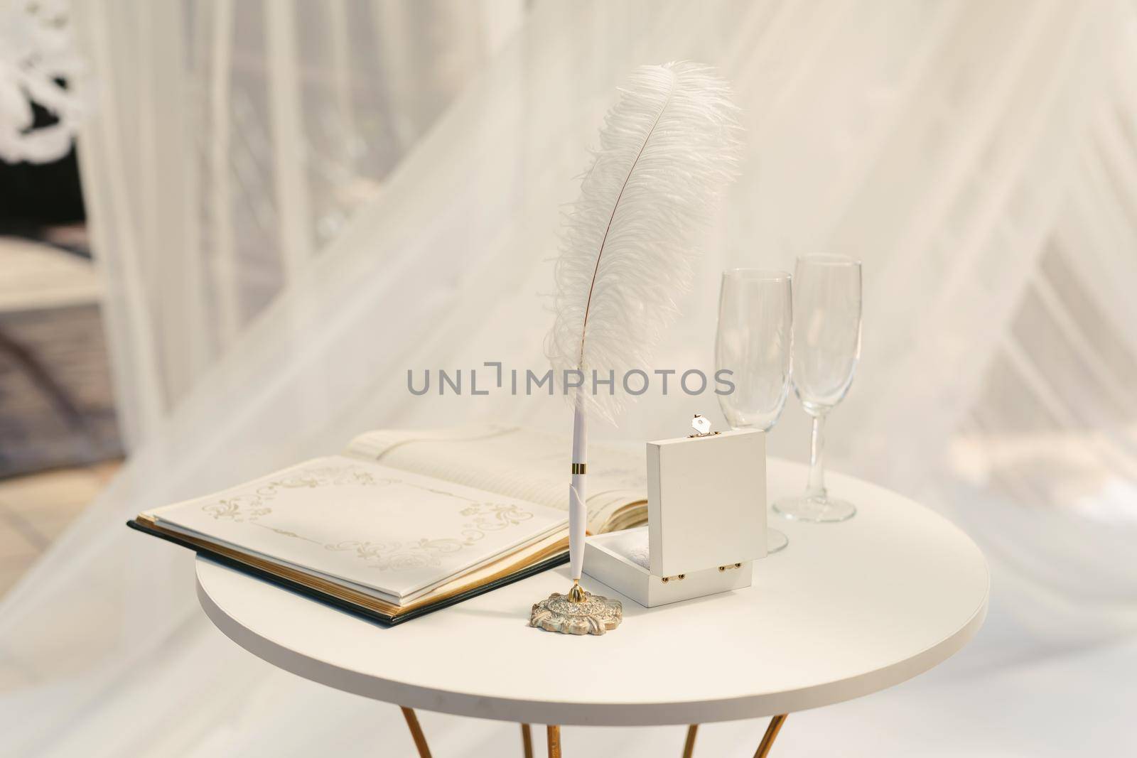 Champagne glasses on the table for registration at the wedding ceremony by StudioPeace