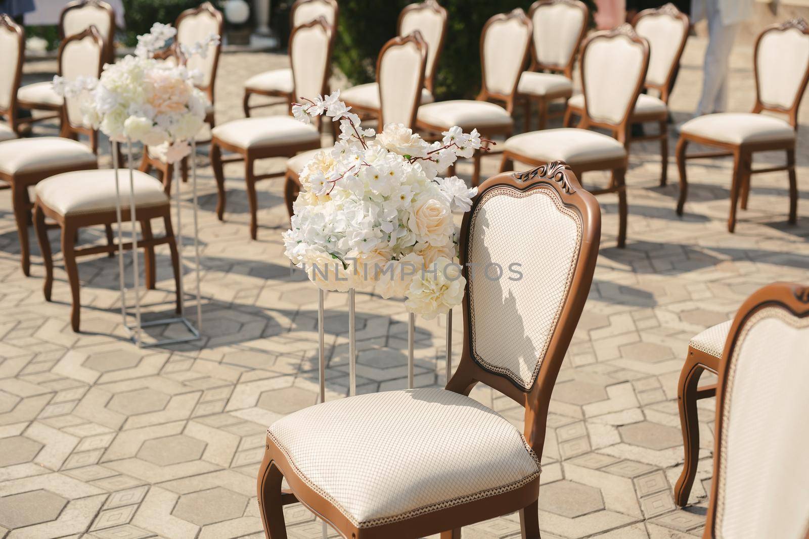 Beautiful wedding floral arrangement of seats along the aisle