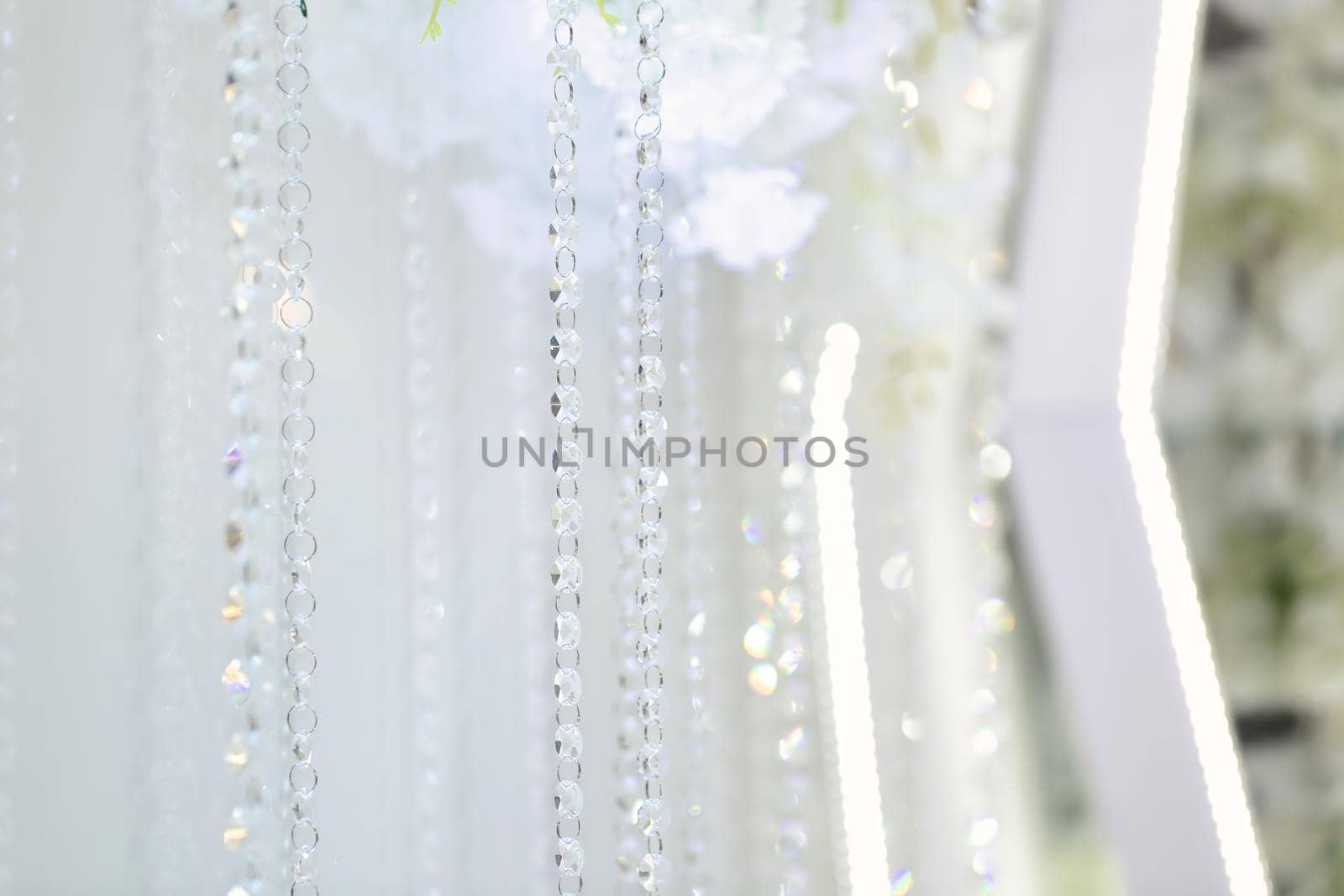Details of the wedding ceremony made of fresh flowers, sparkling beads. Delicate and beautiful wedding decor for newlyweds by StudioPeace
