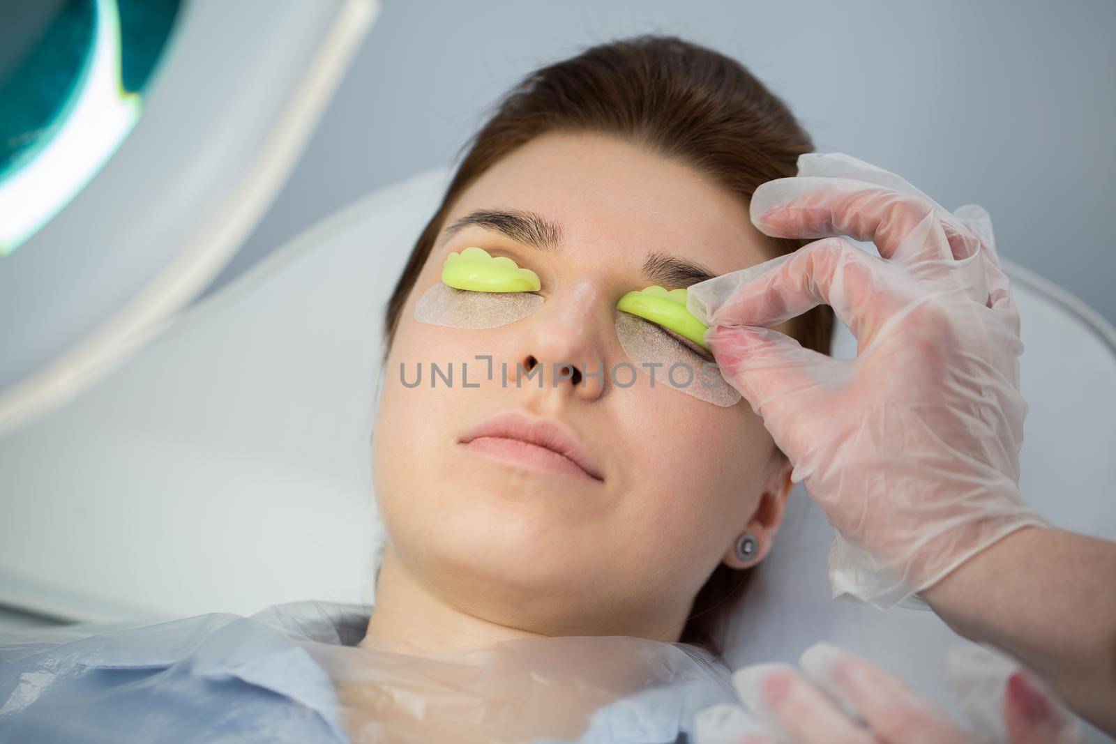 Eyelash Extension Procedure. Woman Eye with Long Eyelashes. Lashes, close up, selected focus