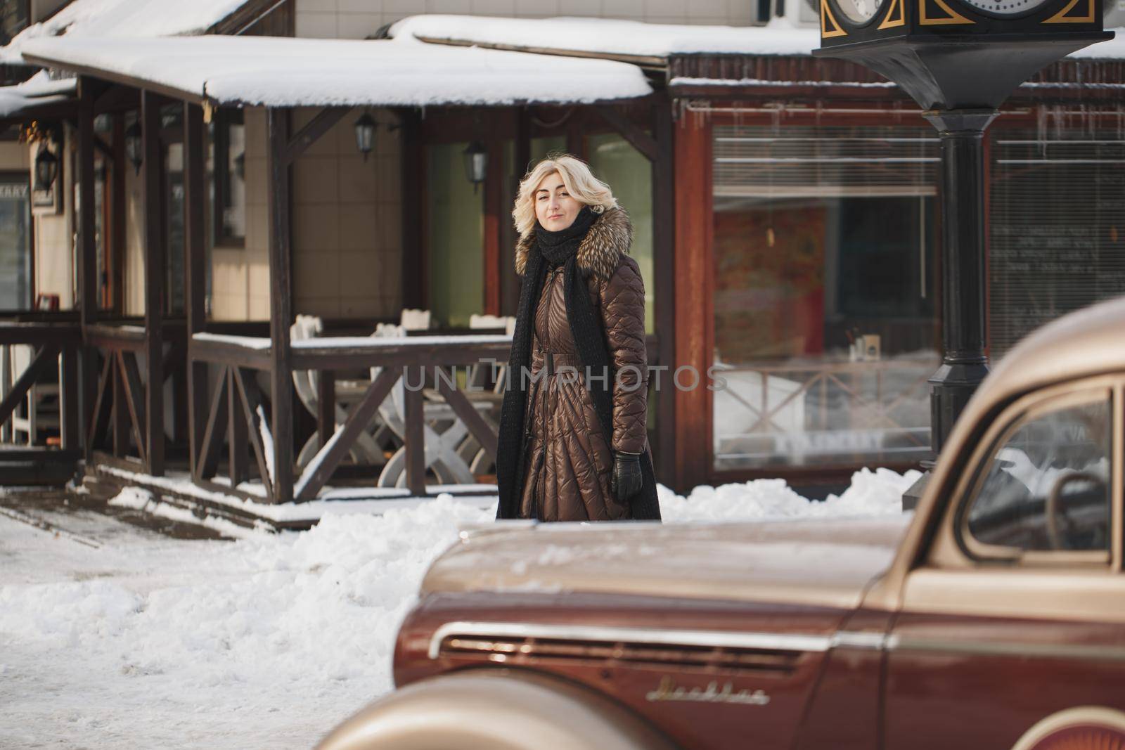 Beautiful woman posing in winter time in the city.