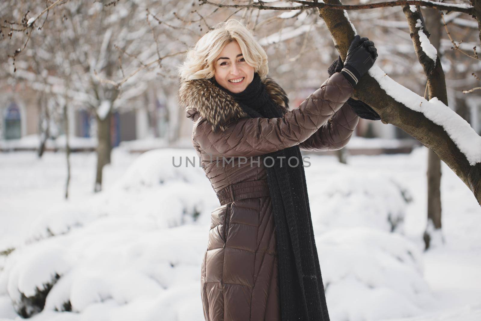 A beautiful woman posing in a winter park by StudioPeace