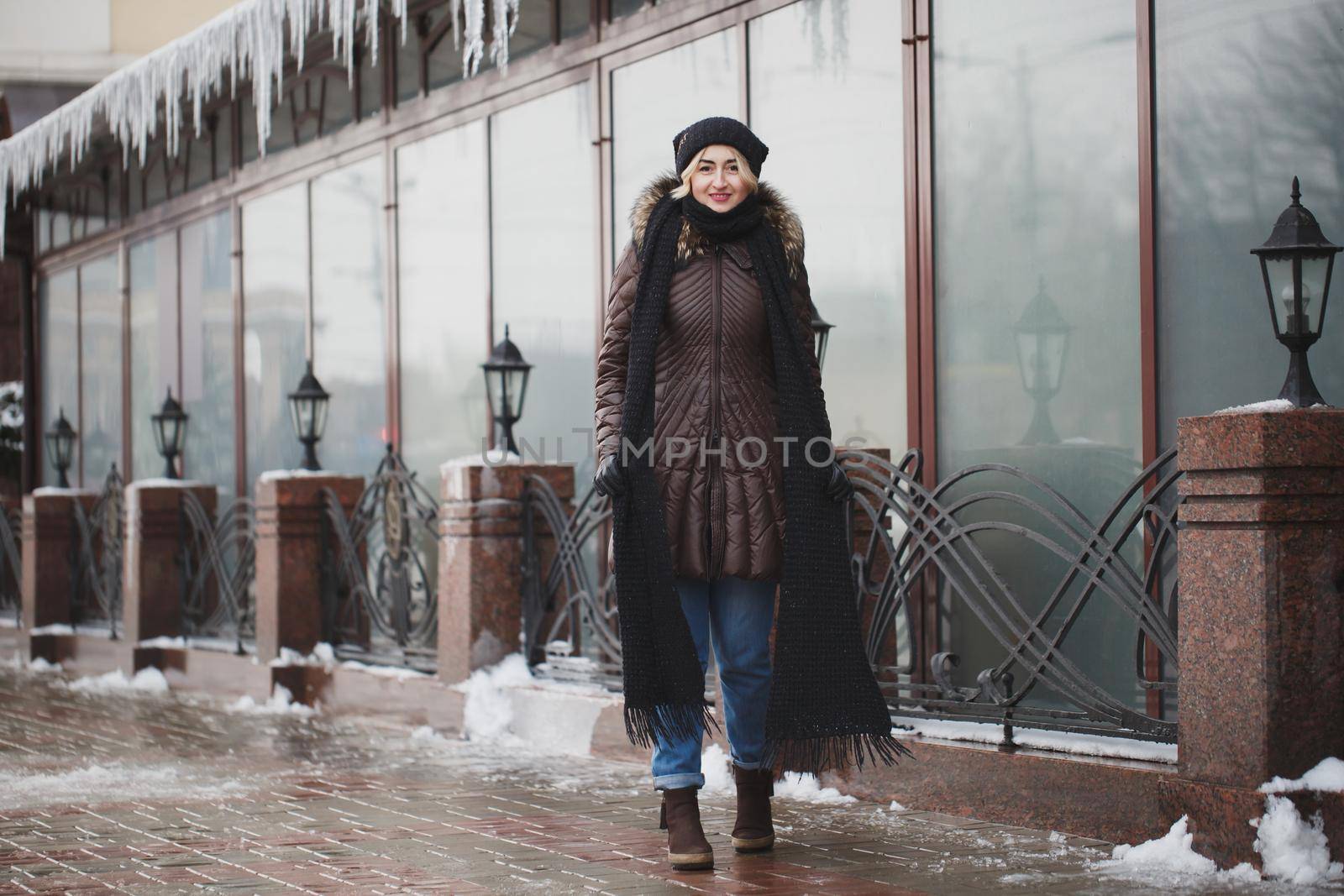 portrait of beautiful happy smiling woman posing outdoors in winter by StudioPeace