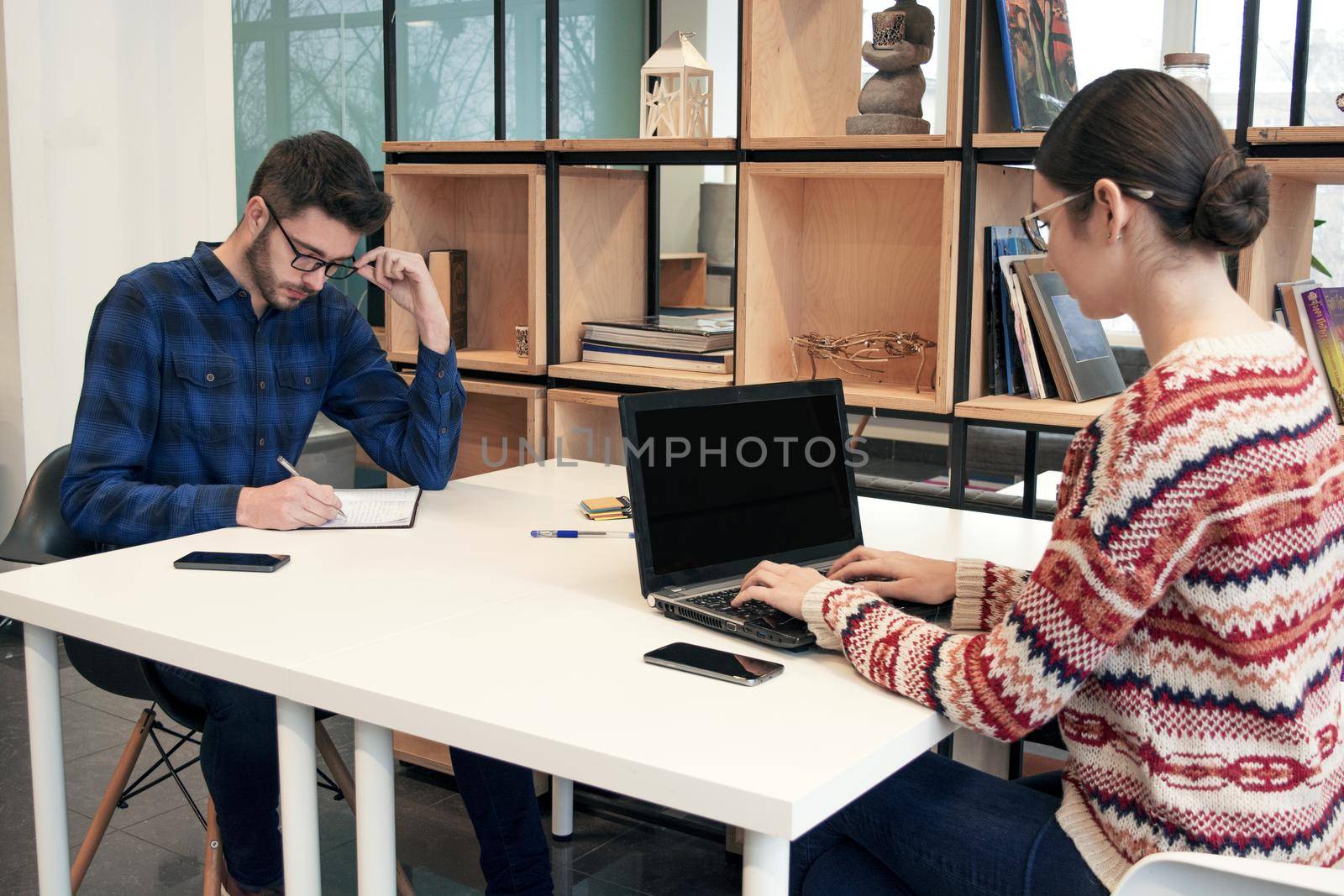 Girl student at workplace at college. Students class at campus. Digital library class and online webinar. School and online education concept. Millennial generation concept and outsourcing business indoor.